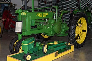 Antique John Deere tractor and toy tractor